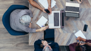 People collaborating around a table for a project